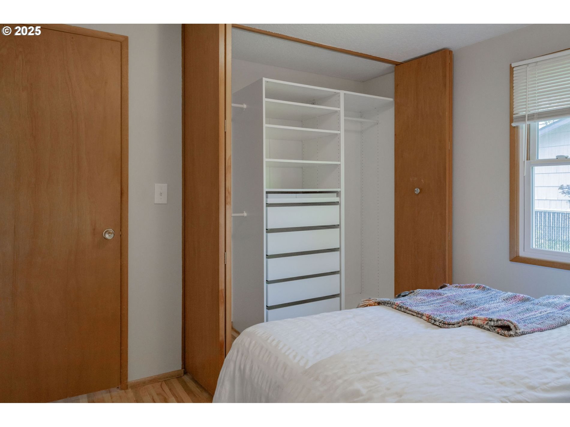 75 Northwest 22nd Street Gresham, OR 97030 - Photo 18 of 32 a bedroom with a bed and a window