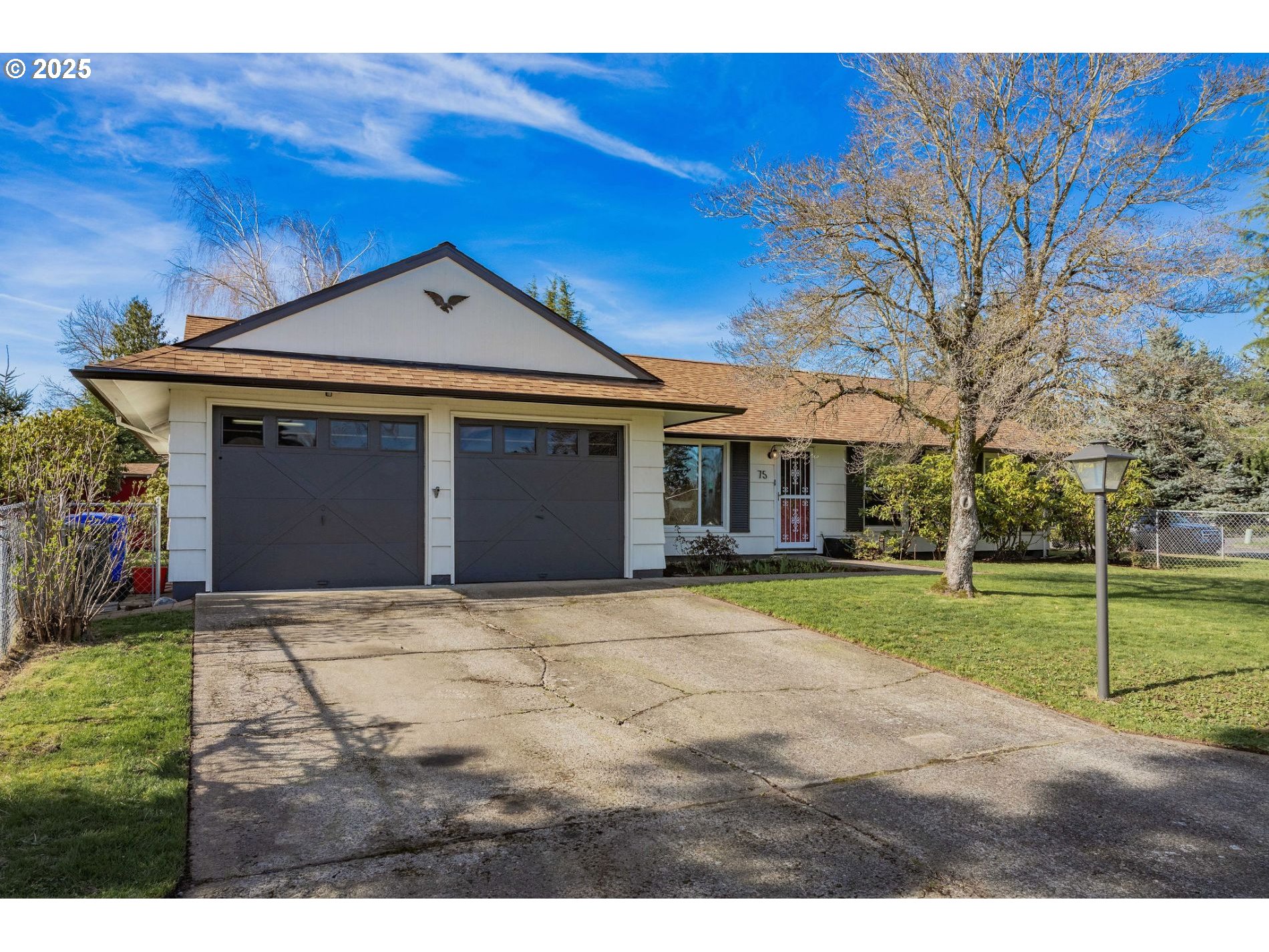 75 Northwest 22nd Street Gresham, OR 97030 - Photo 2 of 32 a front view of a house with a yard
