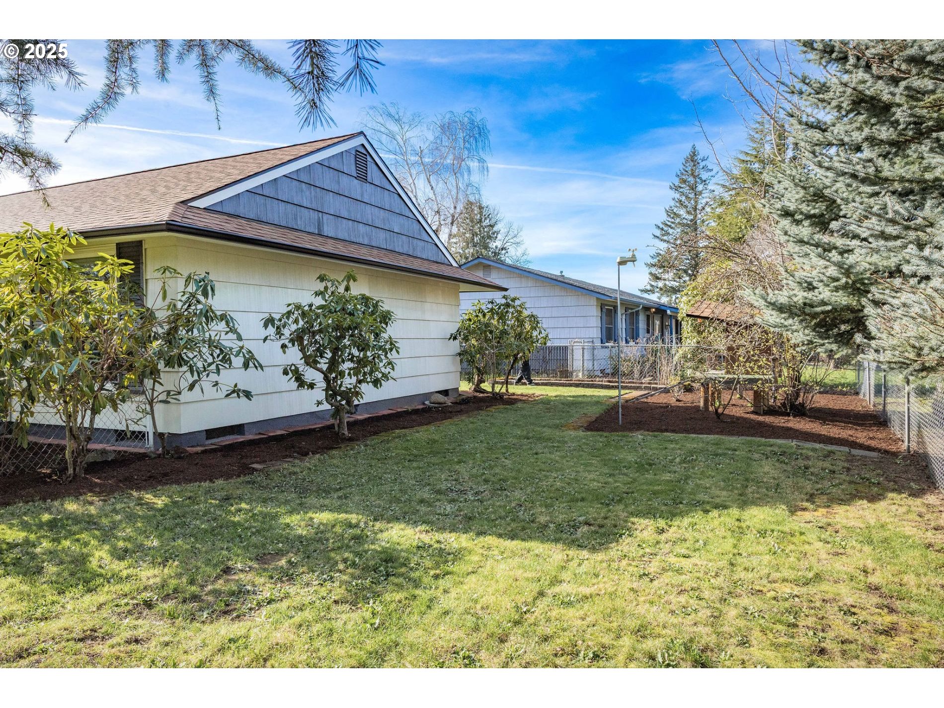 75 Northwest 22nd Street Gresham, OR 97030 - Photo 28 of 32 a backyard of a house with lots of green space