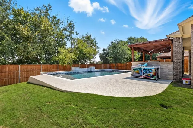a view of a backyard with sitting area