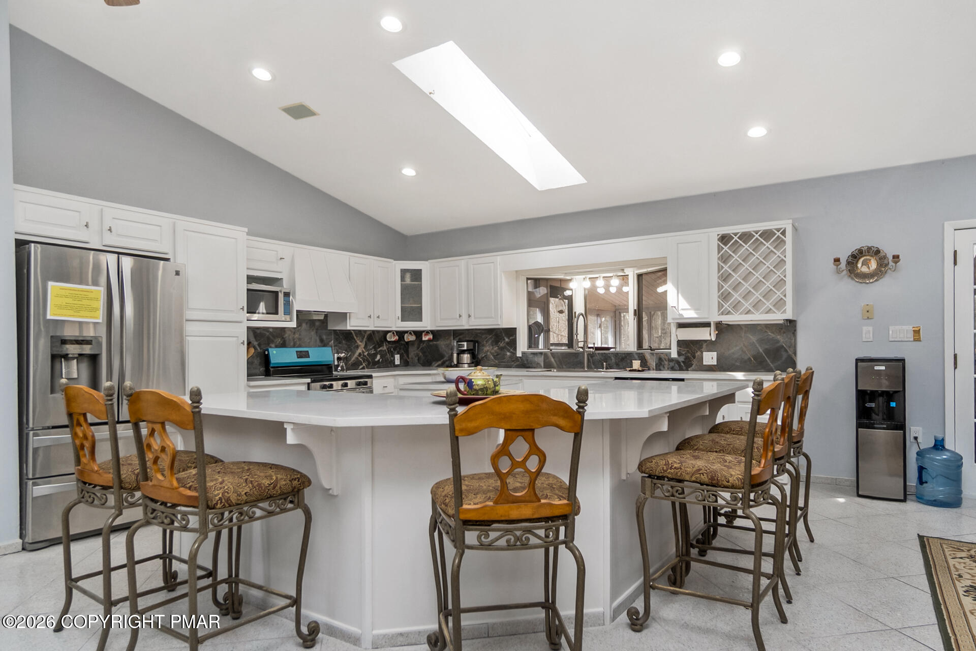175 Winding Way Albrightsville, PA 18210 - Photo 11 of 54 a kitchen with stainless steel appliances granite countertop a dining table chairs and white cabinets