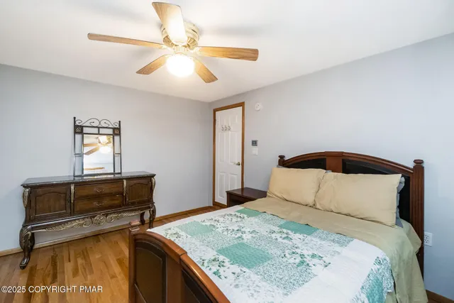 a bedroom with a bed and a dresser