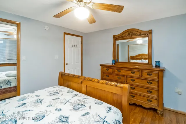 a bedroom with a bed and a dresser