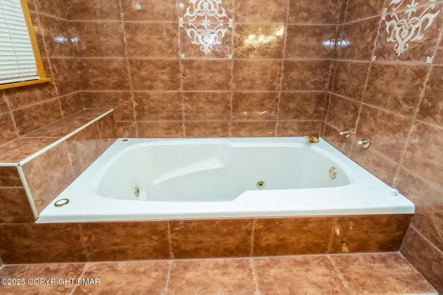 a bathroom with a bath tub