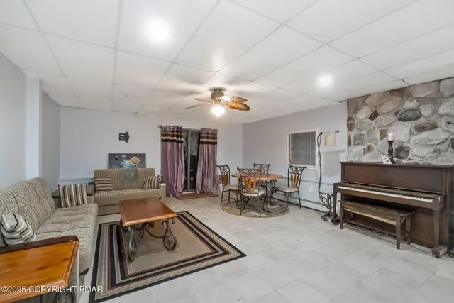 a living room with furniture and a chandelier