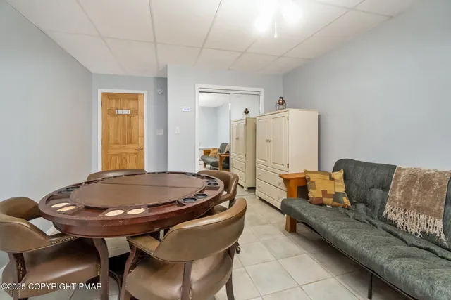 a living room with furniture and a table