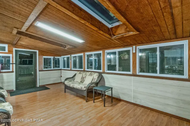 a balcony with furniture and a potted plant