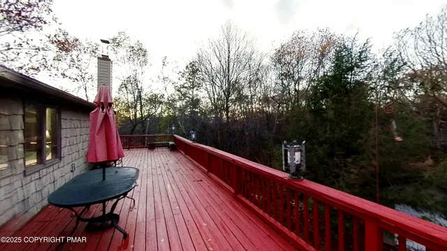 a view of a balcony with outdoor seating