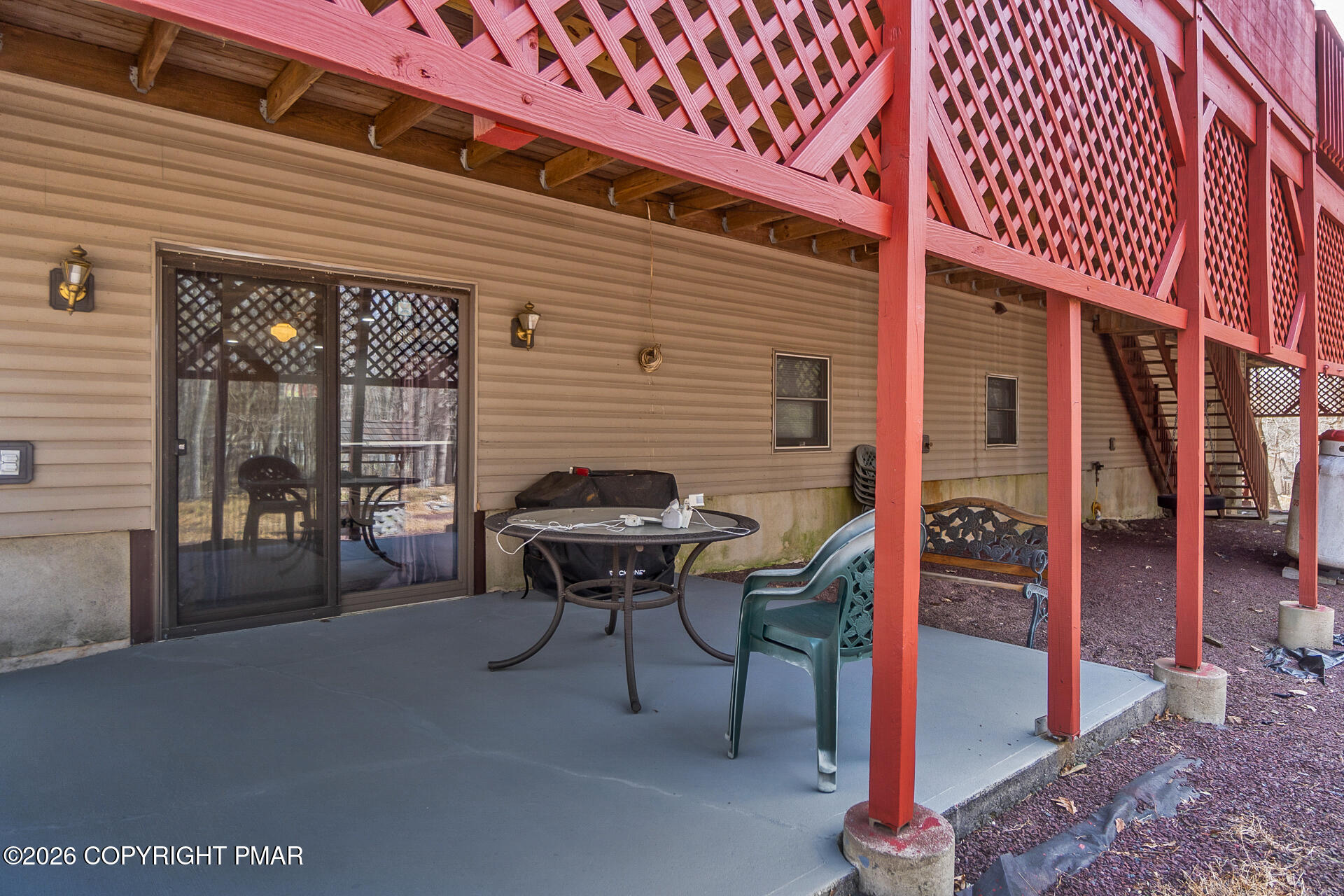 175 Winding Way Albrightsville, PA 18210 - Photo 52 of 54 a view of a patio with table and chairs and wooden fence