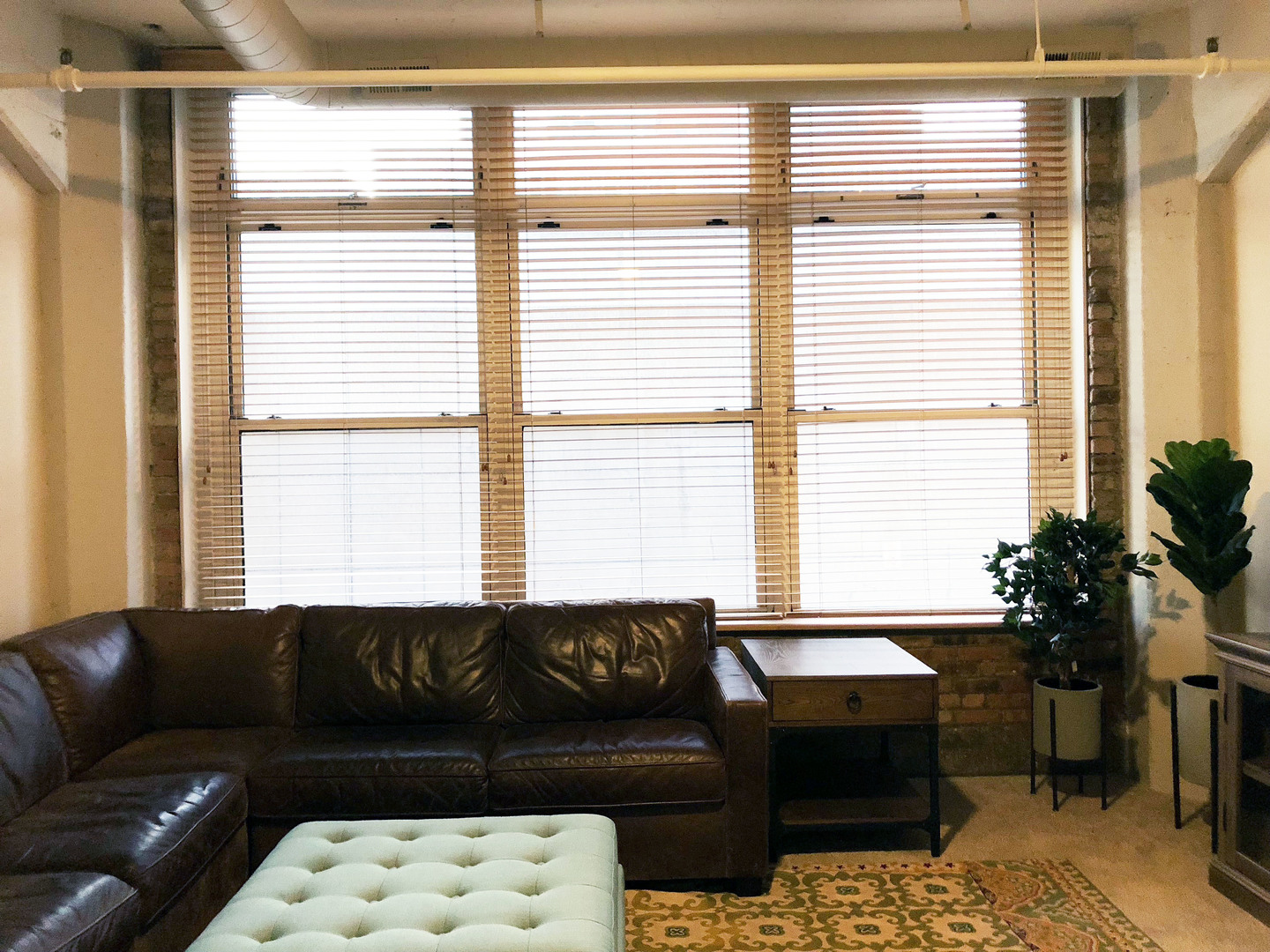 124 West Polk Street, Unit 101 Chicago, IL 60605 - Photo 6 of 14 a living room with furniture and a large window