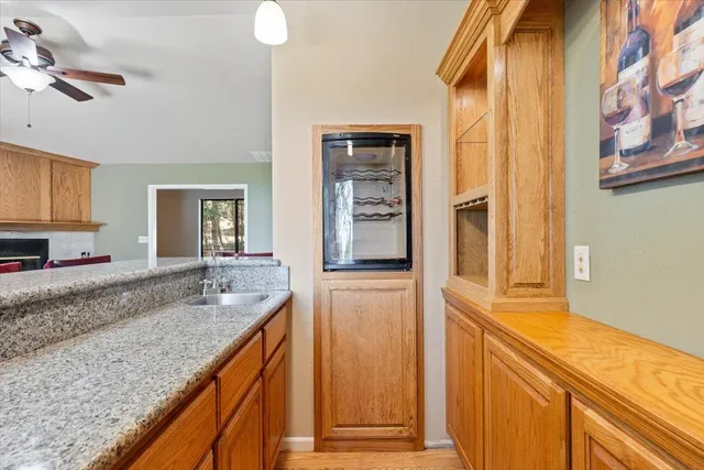 a kitchen with stainless steel appliances a sink and a refrigerator