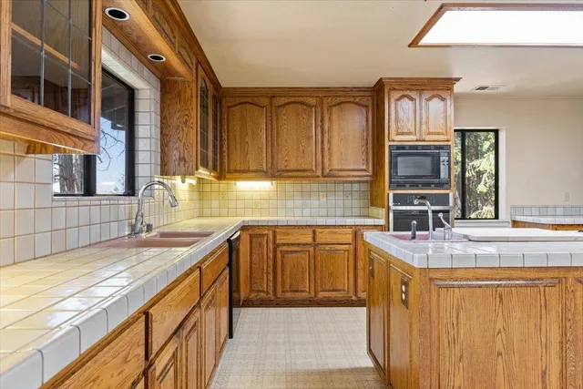 a view of a livingroom with an empty space and a fireplace