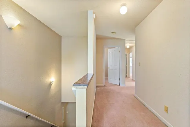 a kitchen with granite countertop a sink a stove and cabinets