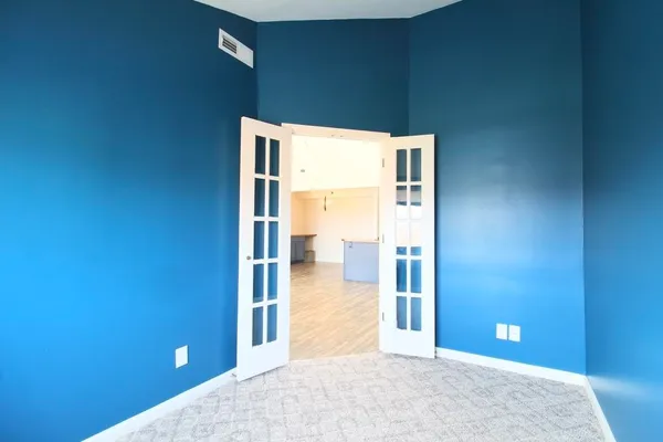 a view of a livingroom with a kitchen