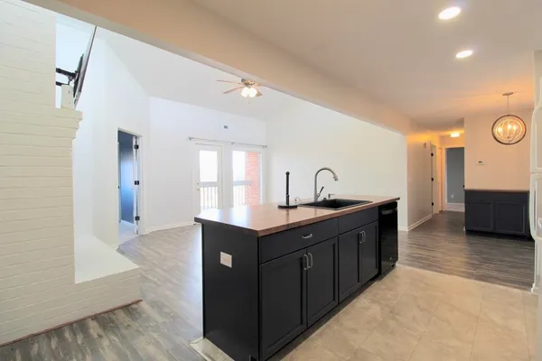 a kitchen with a sink and cabinets