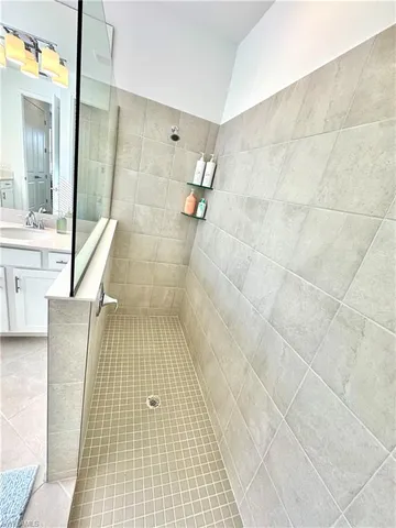 a view of a swimming pool with chairs in patio