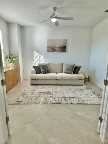 a living room with a couch and a window