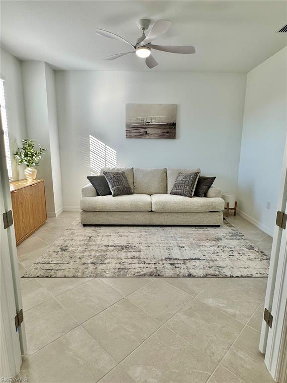 5376 Fancourt Links Way Ave Maria, FL 34142 - Photo 3 of 39 a living room with furniture and a couch