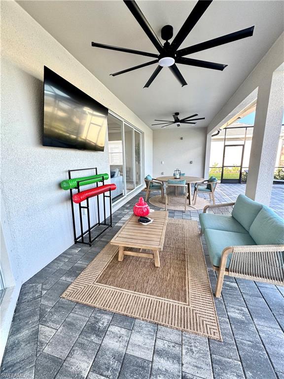 5376 Fancourt Links Way Ave Maria, FL 34142 - Photo 33 of 39 a living room with furniture and a flat screen tv