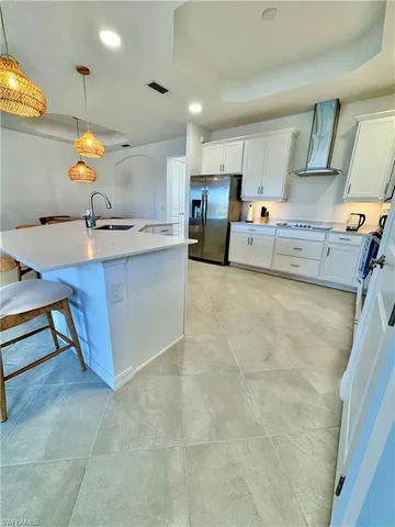 a bedroom with double bed and a window