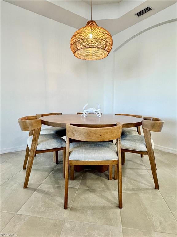 5376 Fancourt Links Way Ave Maria, FL 34142 - Photo 10 of 39 a view of a dining room with furniture