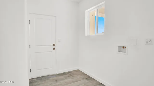 a view of a kitchen from the hallway