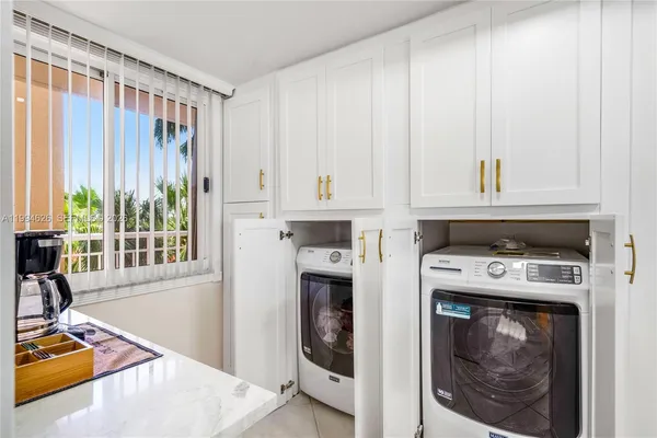 a view of a kitchen with an empty space and a window