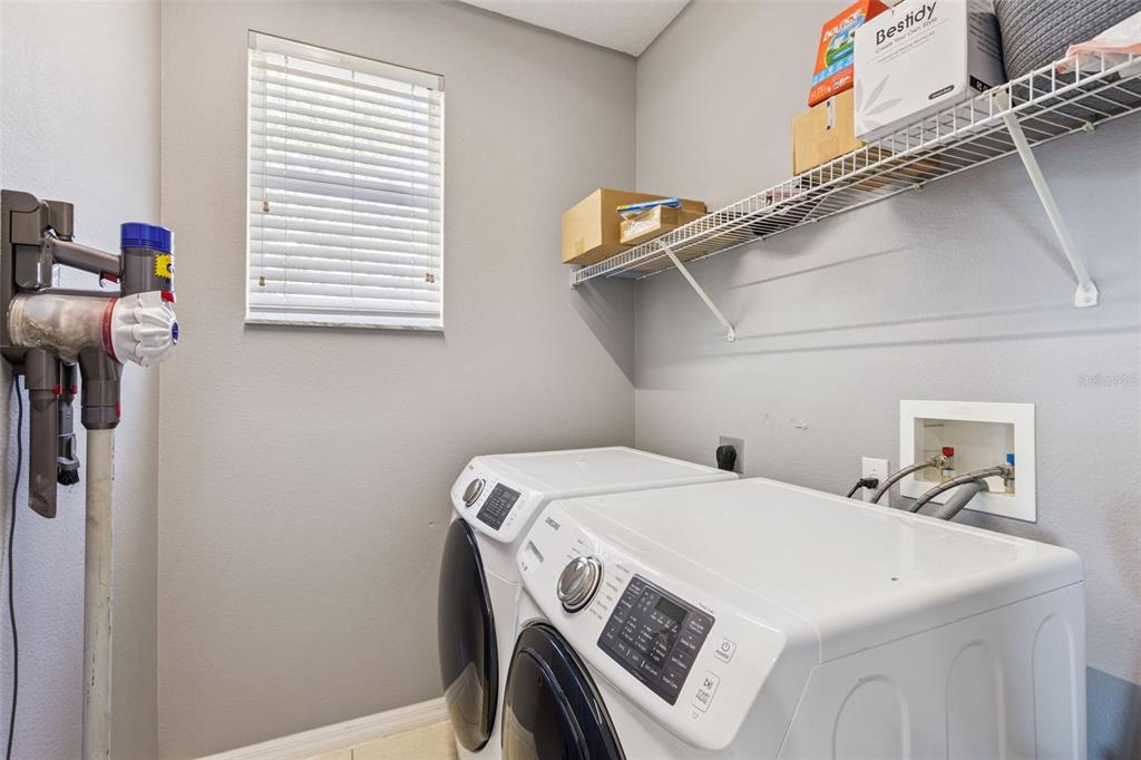 2718 Curpin Lane Orlando, FL 32825 - Photo 18 of 36 a utility room with dryer and washer