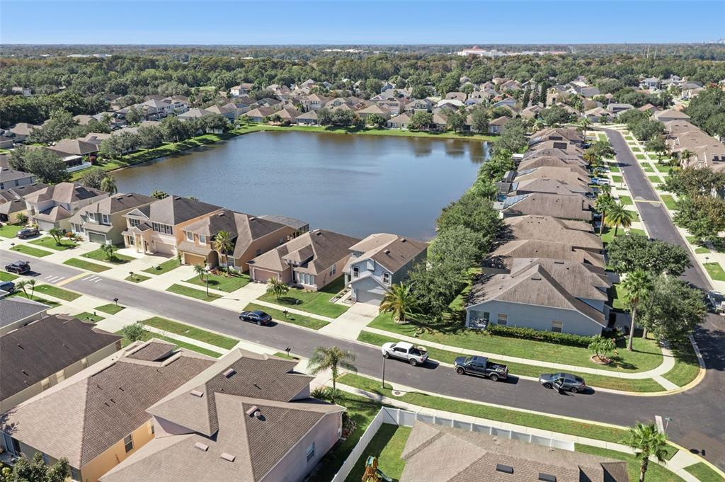2718 Curpin Lane Orlando, FL 32825 - Photo 28 of 36 an aerial view of a house with a lake view