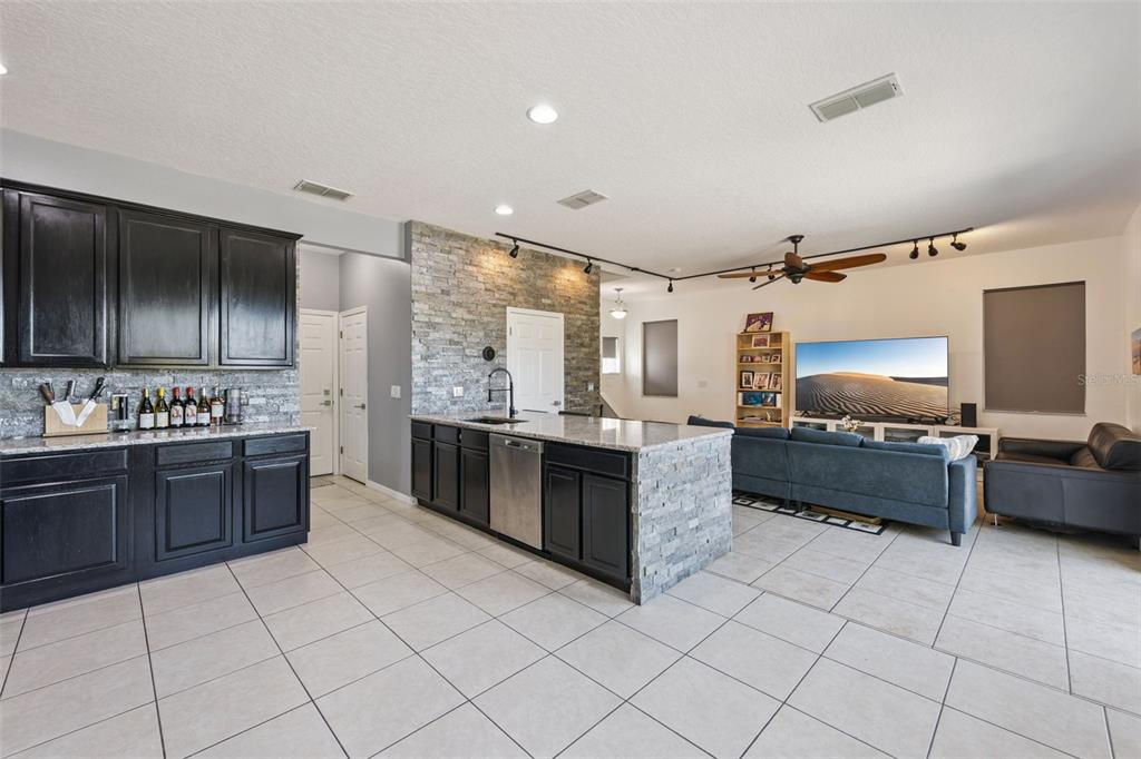 2718 Curpin Lane Orlando, FL 32825 - Photo 4 of 36 a large kitchen with a stove a sink dishwasher and a refrigerator