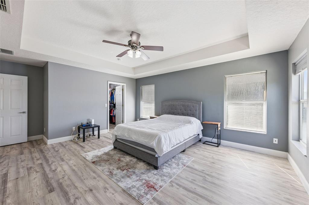 2718 Curpin Lane Orlando, FL 32825 - Photo 9 of 36 a living room with a bed furniture and a window