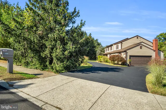 a view of an entryway with wooden floor and a livingroom view