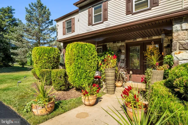 a view of entryway with livingroom and chandelier