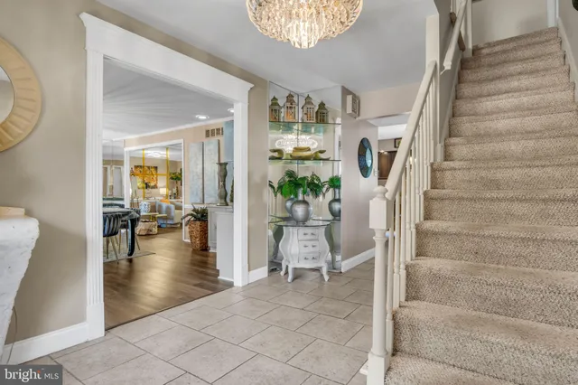 a kitchen with stainless steel appliances a sink stove and cabinets