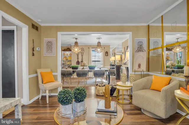 a view of a deck with dining table and chairs next to a yard