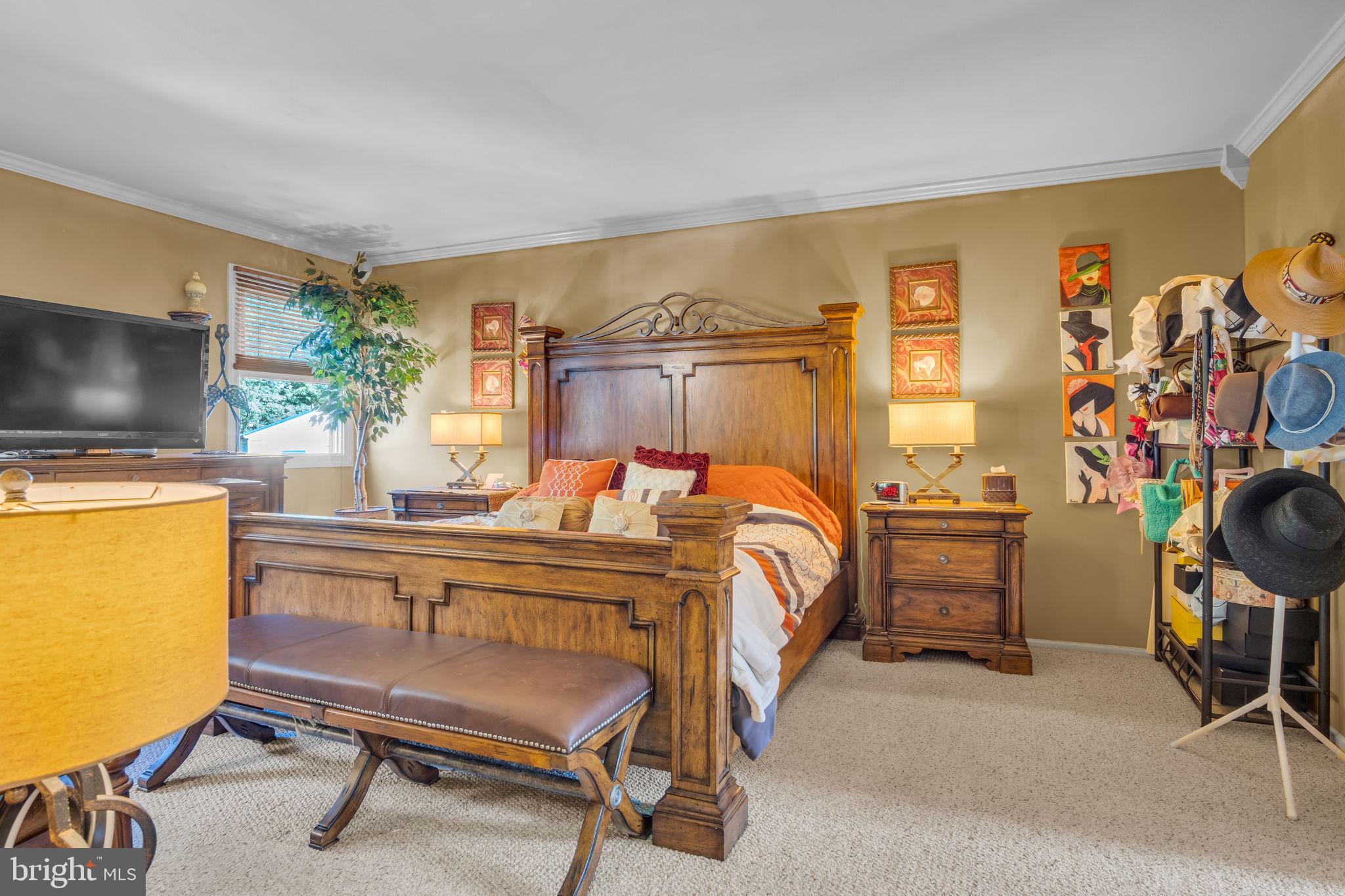 4280 Frontier Road Hatboro, PA 19040 - Photo 32 of 62 a bedroom with a bed and a flat screen tv