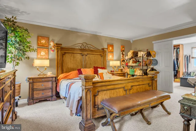 a bedroom with a bed and a couch