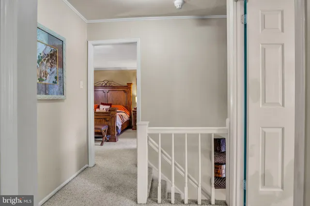 a bed room with a bed and a chair