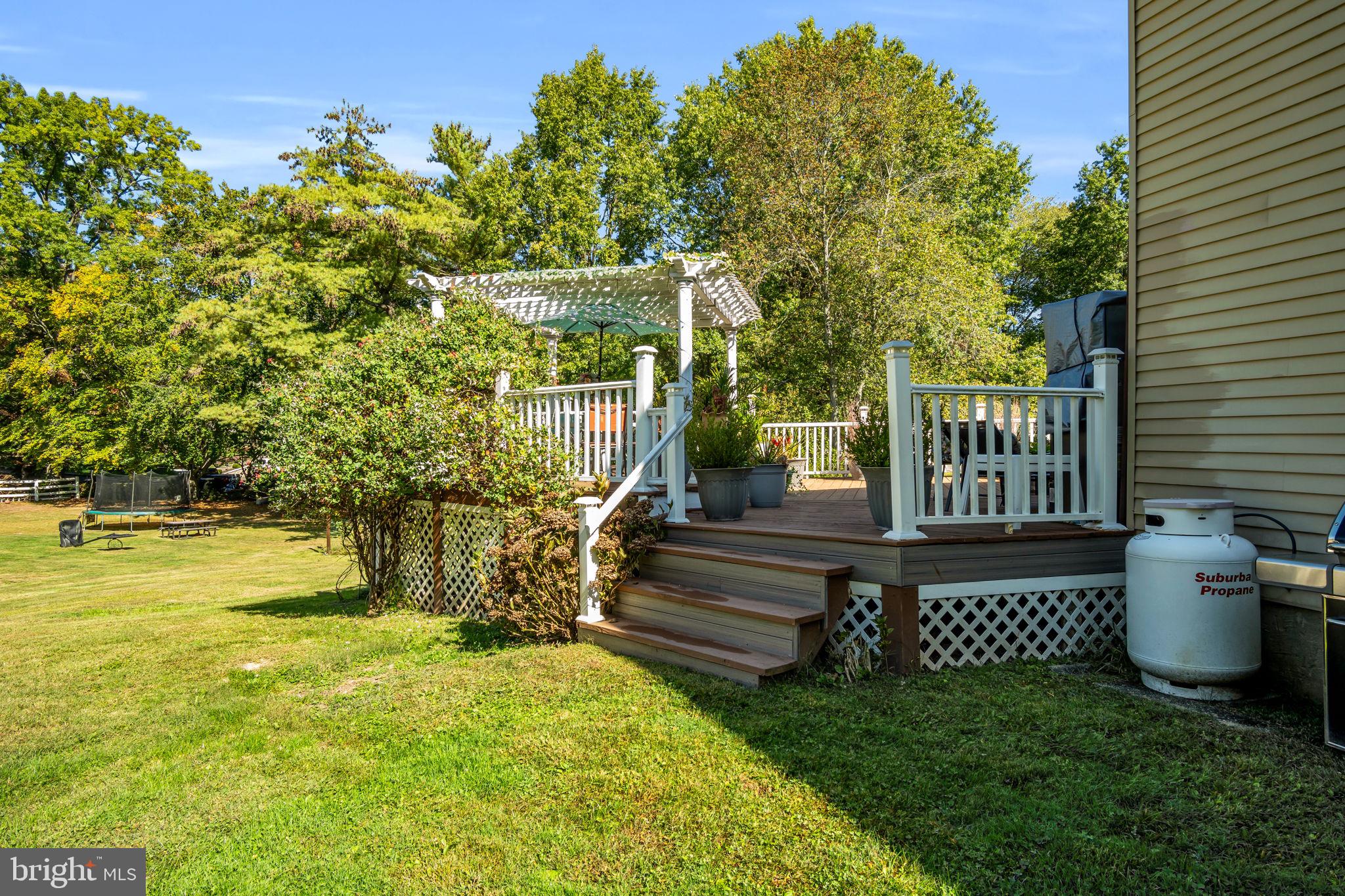 4280 Frontier Road Hatboro, PA 19040 - Photo 55 of 62 a view of a patio with table and chairs and potted plants and large tree