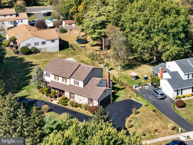 an aerial view of a house with a garden