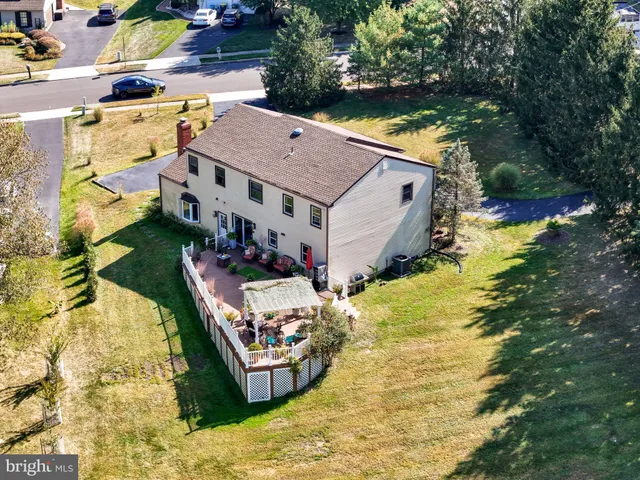 an aerial view of house with yard swimming pool and outdoor seating