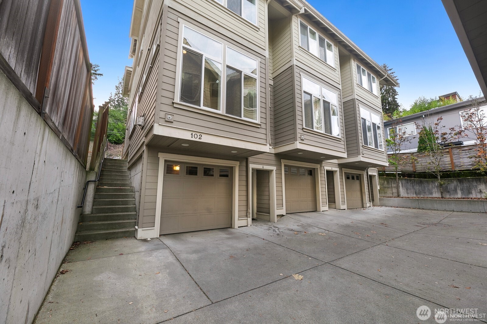 102 West Florentia Street, Unit A Seattle, WA 98119 - Photo 1 of 19 a front view of a house with a yard
