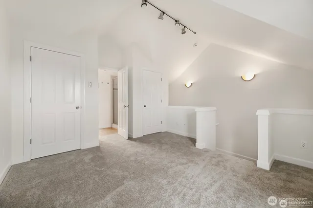 a view of a big room with closet and windows