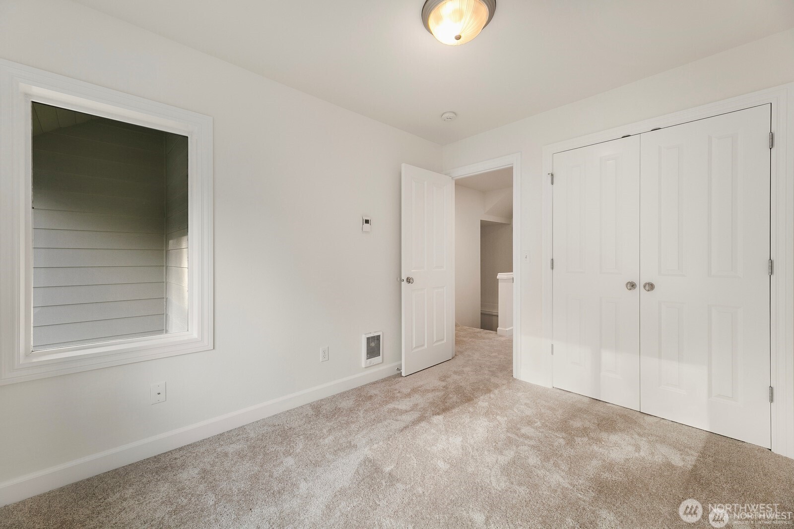 102 West Florentia Street, Unit A Seattle, WA 98119 - Photo 16 of 19 a view of an empty room with a window