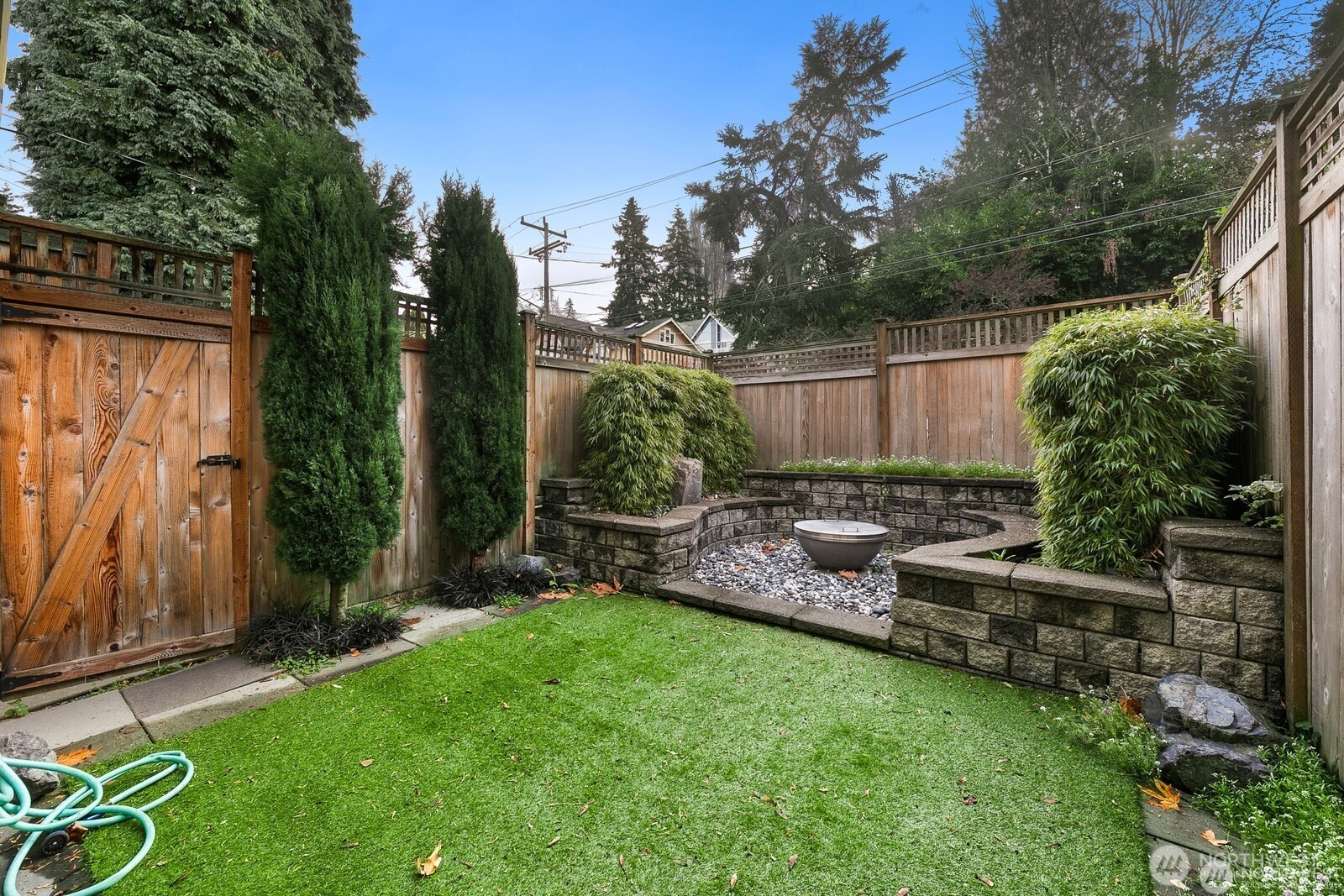 102 West Florentia Street, Unit A Seattle, WA 98119 - Photo 3 of 19 a view of backyard with plants and outdoor seating