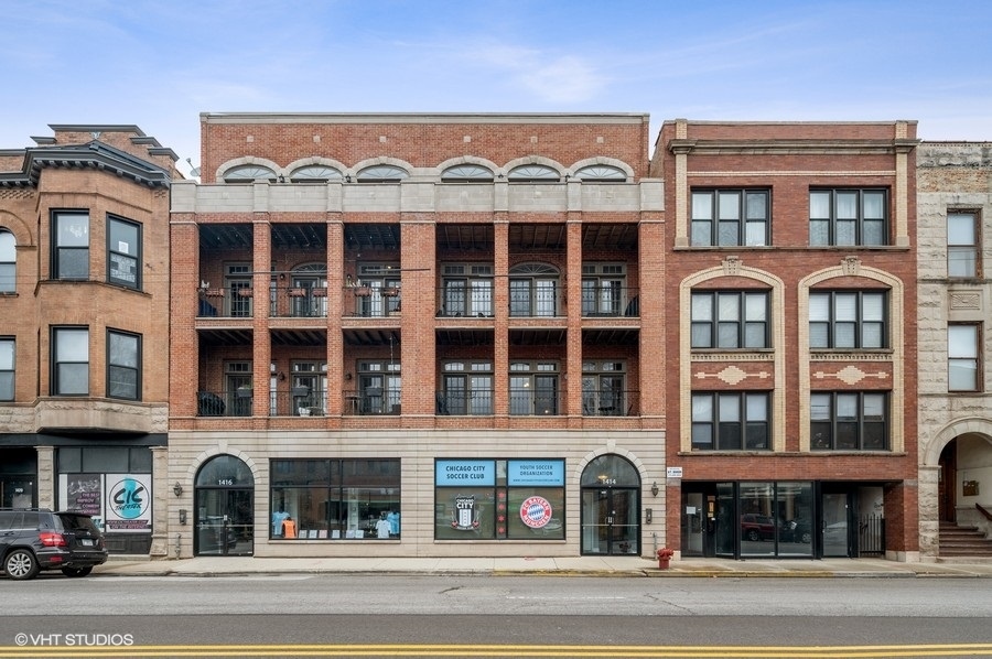 1414 West Irving Park Road, Unit 2E Chicago, IL 60613 - Photo 1 of 19 a view of a building with a street