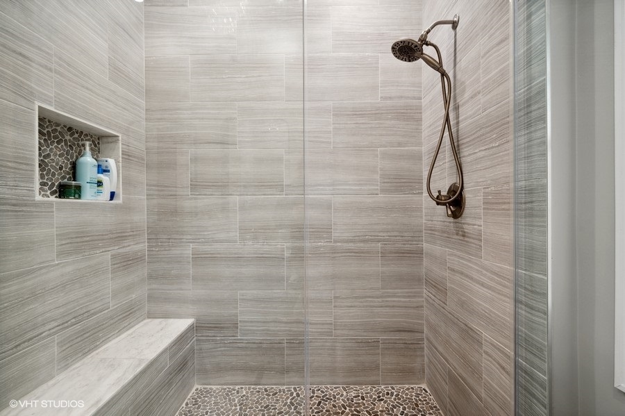 1414 West Irving Park Road, Unit 2E Chicago, IL 60613 - Photo 12 of 19 a bathroom with a shower