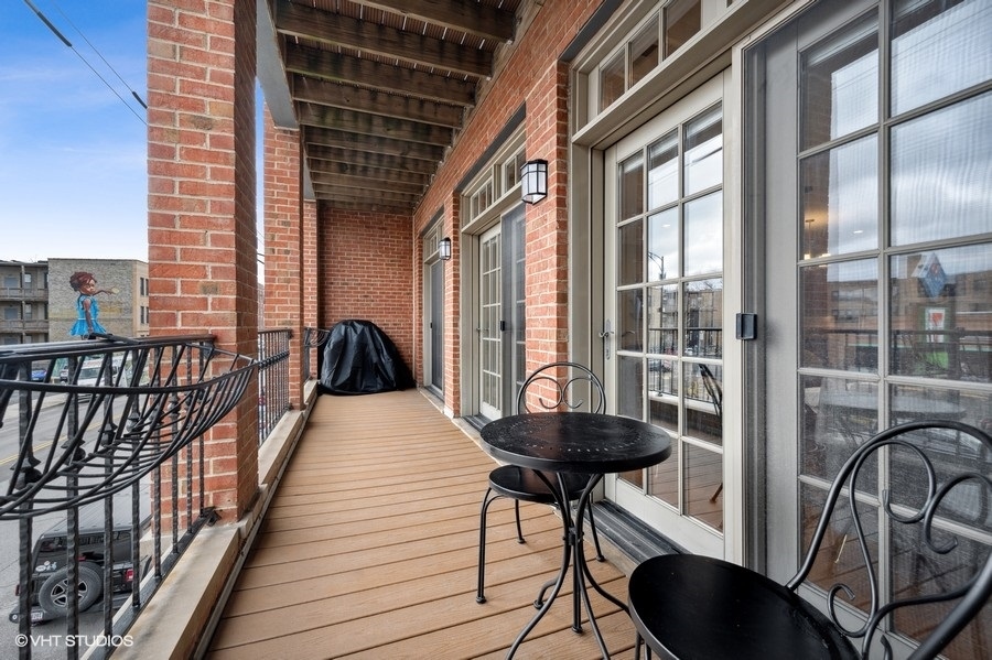 1414 West Irving Park Road, Unit 2E Chicago, IL 60613 - Photo 18 of 19 a view of balcony with furniture