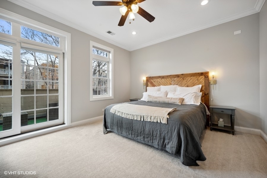 1414 West Irving Park Road, Unit 2E Chicago, IL 60613 - Photo 9 of 19 a bedroom with a bed and window