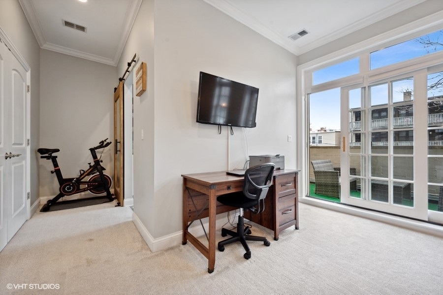1414 West Irving Park Road, Unit 2E Chicago, IL 60613 - Photo 10 of 19 a view of a workspace with a window